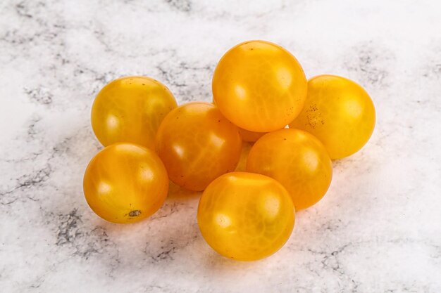 Ripe tasty yellow cherry tomato heap