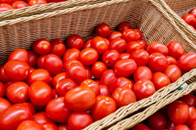 Ripe tomatoes are in the store in a drawer