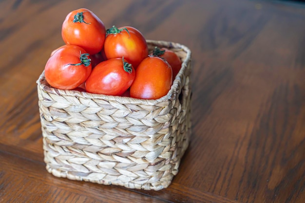 Ripe tomatoes in a basket after annual harvest