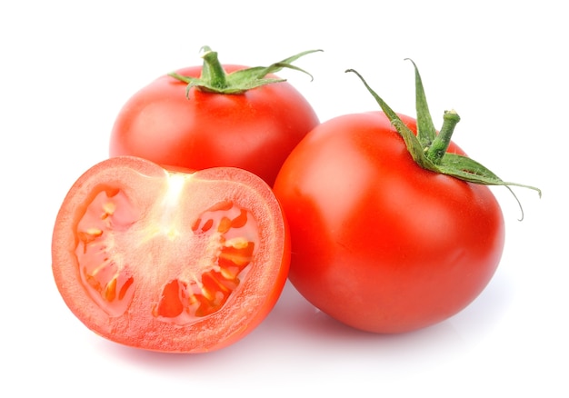 Ripe tomatoes closeup on white