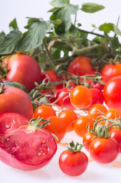 Ripe tomatoes of different sizes and varieties Food background