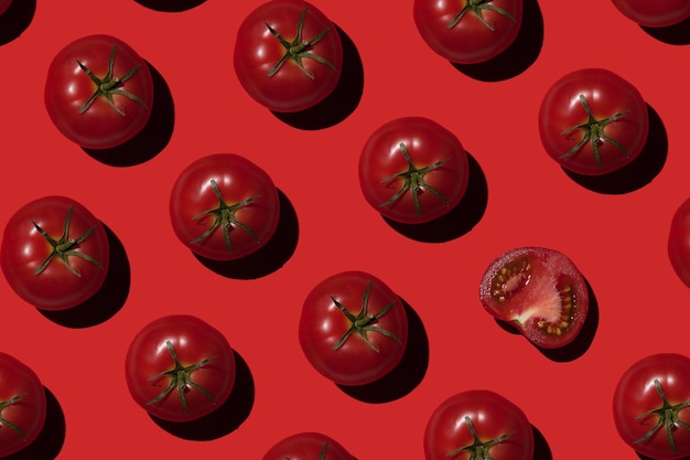 Ripe tomatoes on a red background Vegetables concept