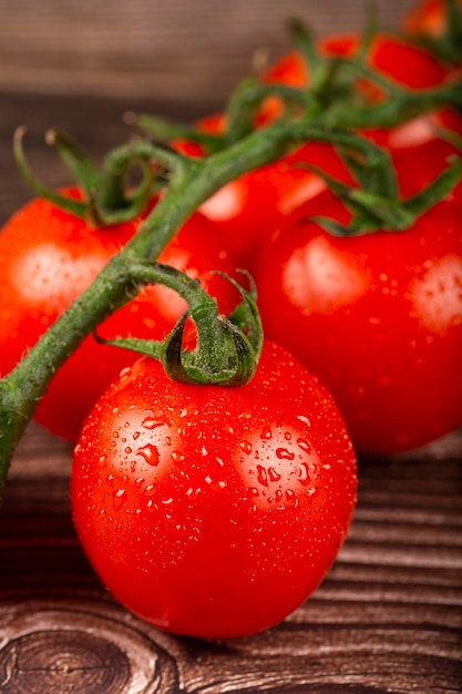 Ripe tomatoes on the wooden table