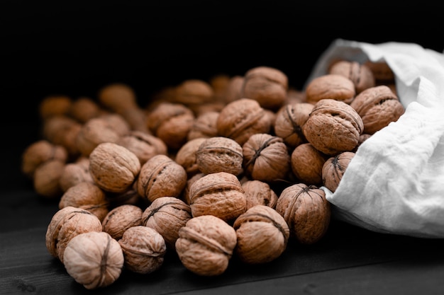 Ripe walnuts on wooden background