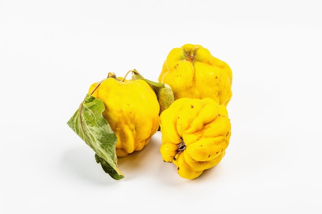 Ripe whole quince isolated on white background. Fresh fruit, an essential ingredient for a healthy food