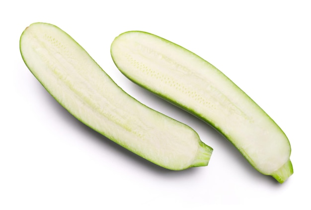 Ripe zucchini sliced in half isolated