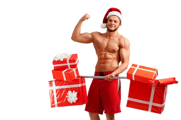 Ripped Santa holding a barbell with presents  