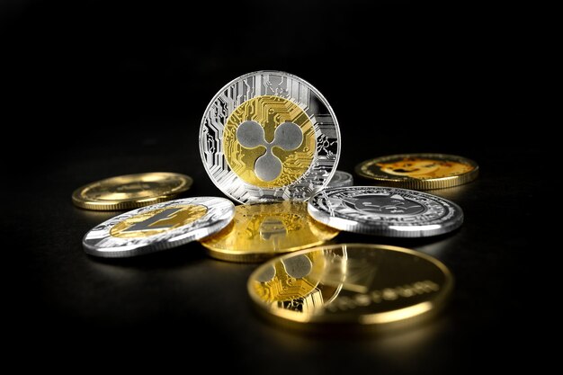 Photo ripple and other cryptocurrency coins on a black background