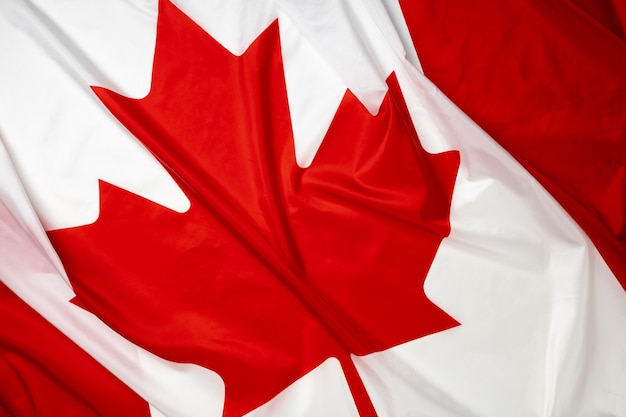 Rippled textile flag of Canada close up photo