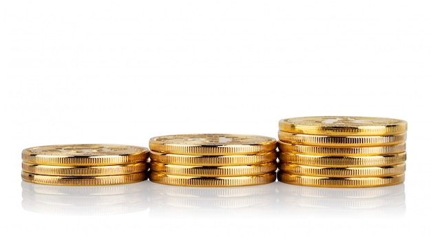 Rising stacks of coins isolated on white wall