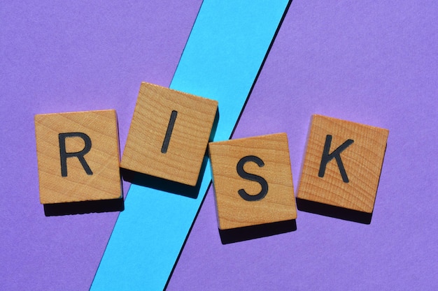 risk word in wooden alphabet letters isolated on background