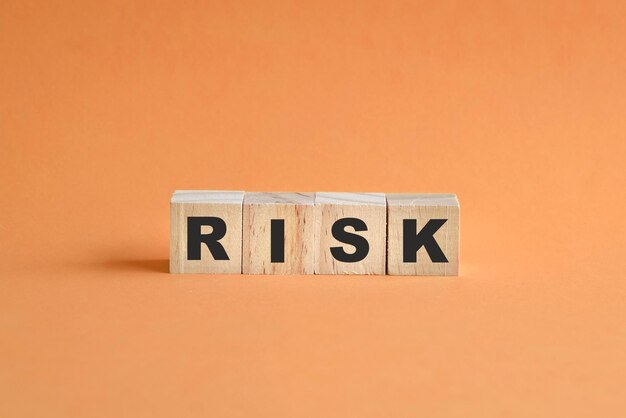 Risk word on wooden cubes arranged on a row