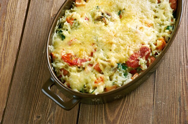 Riso gratinato alle verdure - casserole of rice, vegetables, cheese and mushrooms .Italian Cuisine