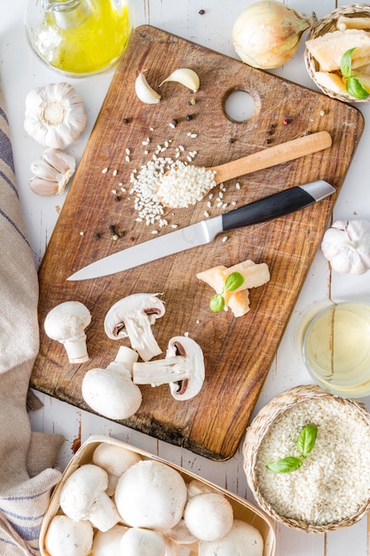 Risotto ingredients on wood board