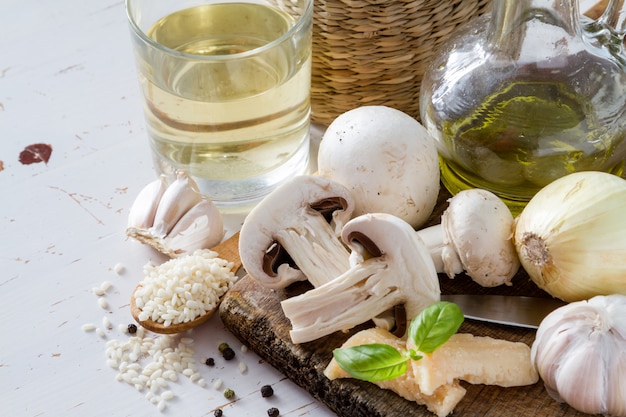 Risotto ingredients on wood board