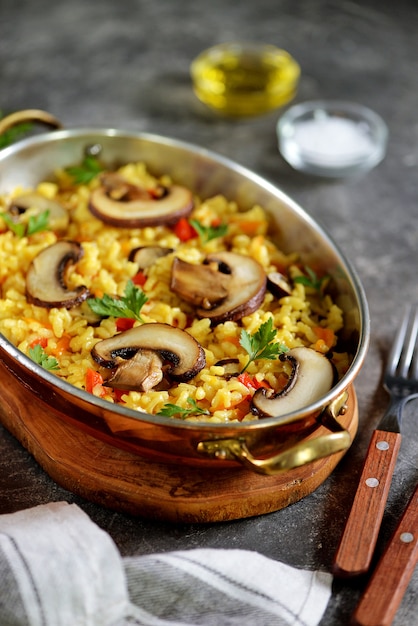 Risotto with mushrooms, bell peppers, carrots, onions, and olive oil