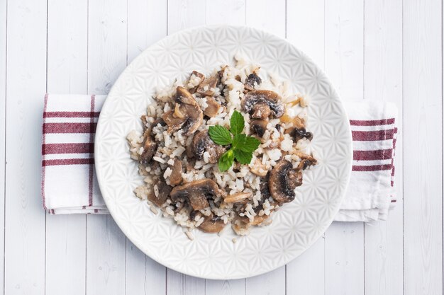 Risotto with mushrooms on a white plate