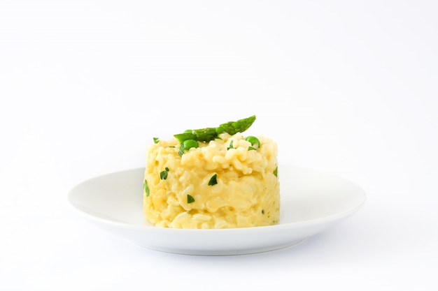 Risotto with peas asparagus and parsley isolated on white background