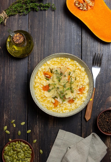 Risotto with pumpkin, cheese and thyme. Vegetarian food. Healthy eating.