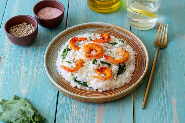 Risotto with shrimps and spinach. Healthy food. Vegetarian food.