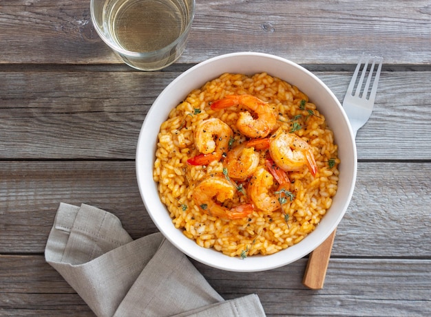 Risotto with shrimps tomatoes and thyme Italian food