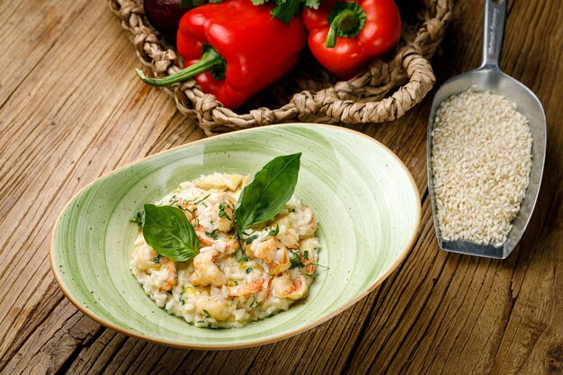 risotto with vegetables on a wooden table