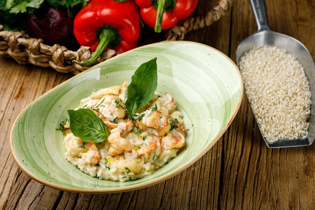 risotto with vegetables on a wooden table