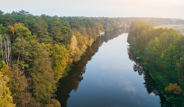 River and autumn forest aerial view