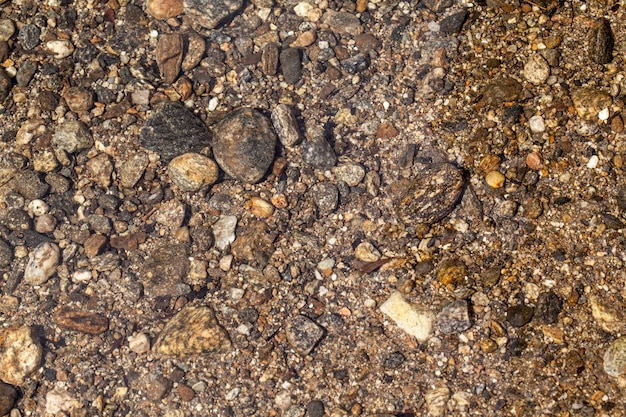 River Bed - Stones beneath the clear water of a river