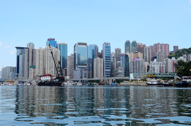 River by buildings against clear sky