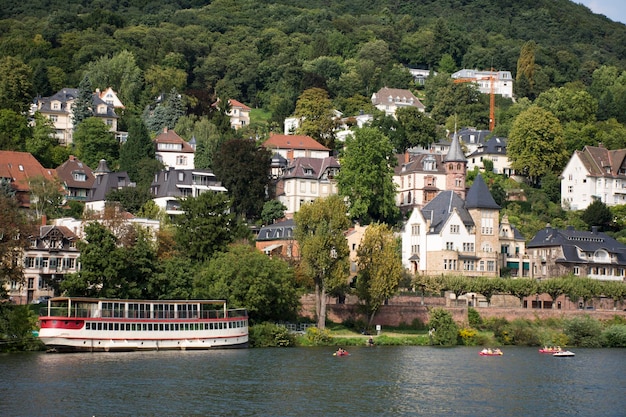 River Cruises riding in Rhine and Neckar river bring passengers traveler visit and looking at riverside of Heidelberg old town on August 26 2017 in Heidelberg Germany