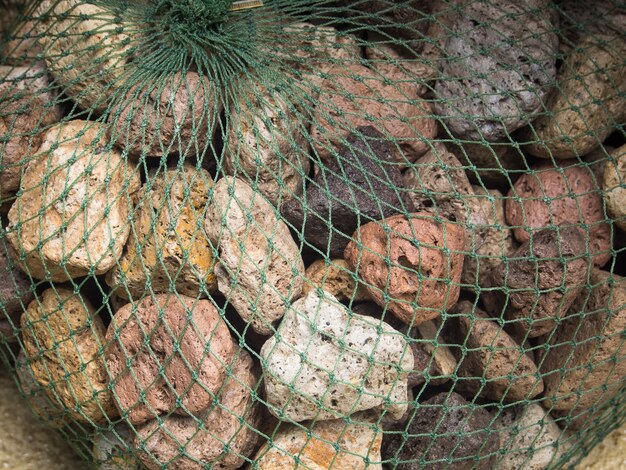 The River stones were wrapped with plastic mesh.