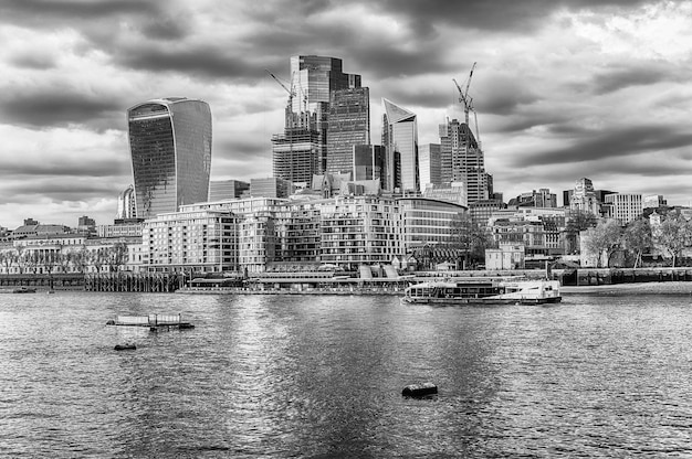 River Thames and city skyline of London England UK