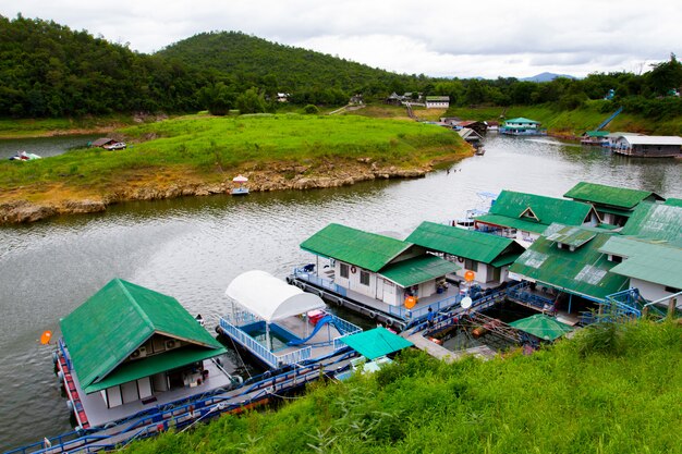 River view at The Forest Resort with raft house on River Kwai in Kanchanaburi, Thailand.