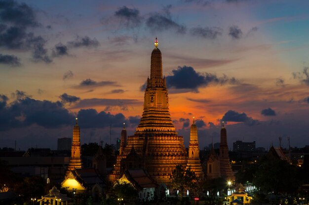 River and Wat Arun Temple at night in Bangkok Thailand