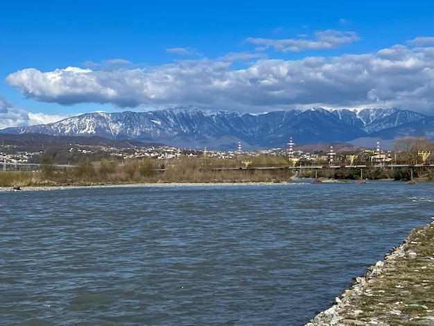 A river with a bridge in the background