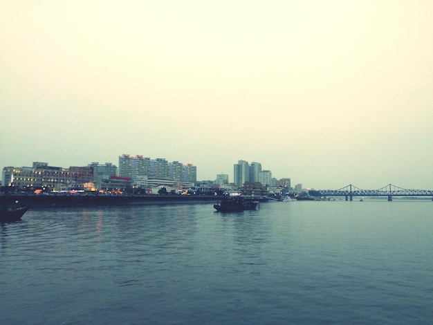 River with buildings in distance with waterfront