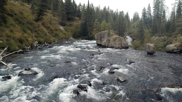 A river with a rock in the middle of it