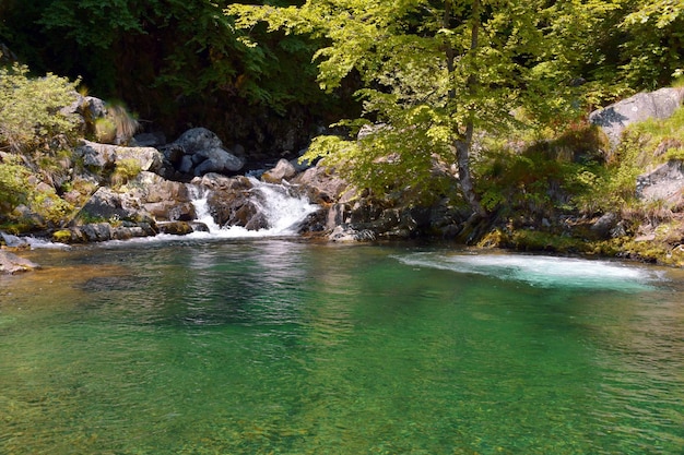 A river with a waterfall in the background