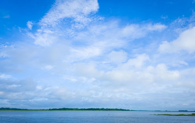 River with white beautiful cloud on blue sky