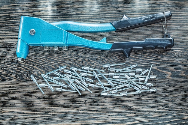 Riveting pliers screws on wooden board