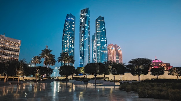 The riyadh towers are lit up at night.