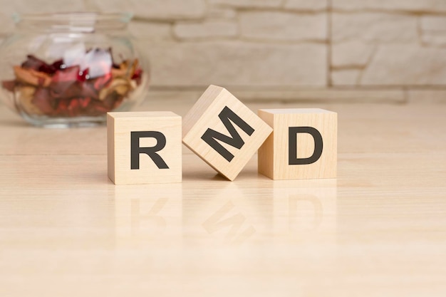 RMD acronym from wooden blocks with letters top view on grey background