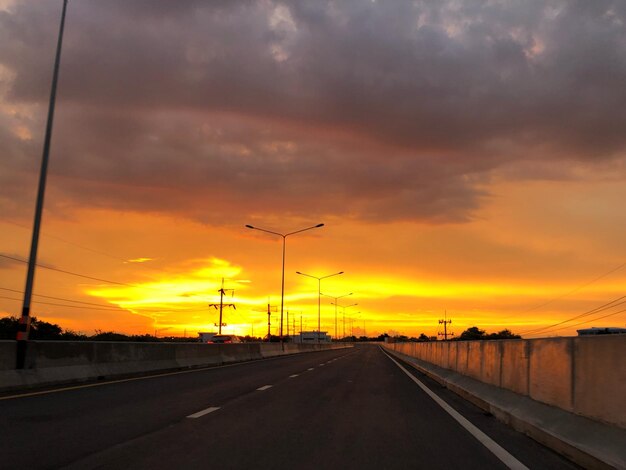 Road against sky during sunset