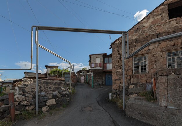 Road amidst buildings against sky