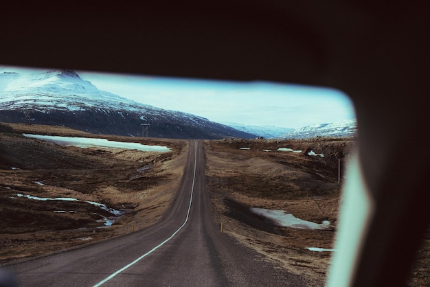 Photo road amidst landscape against sky seen through car windshield