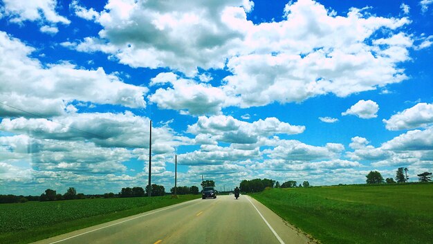 Road amidst landscape against sky