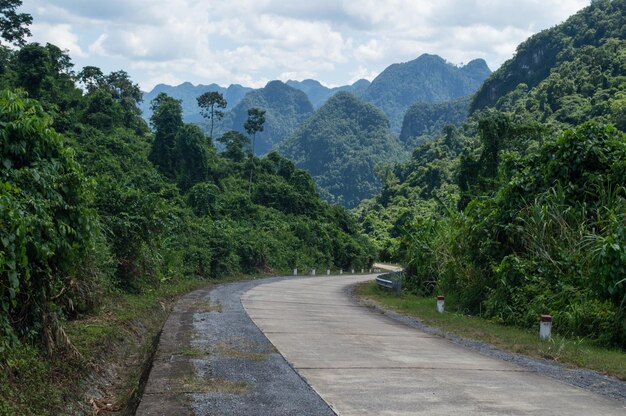 Road amidst mountains against sky