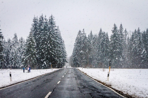 Road amidst snow covered field