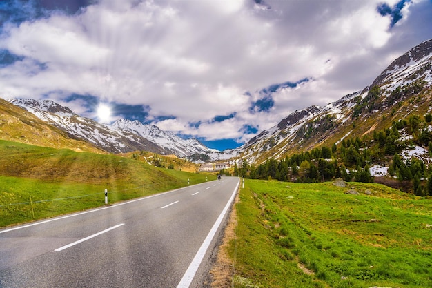 Road amoung snowy Alps mountains Fluelapass Davos Graubuende